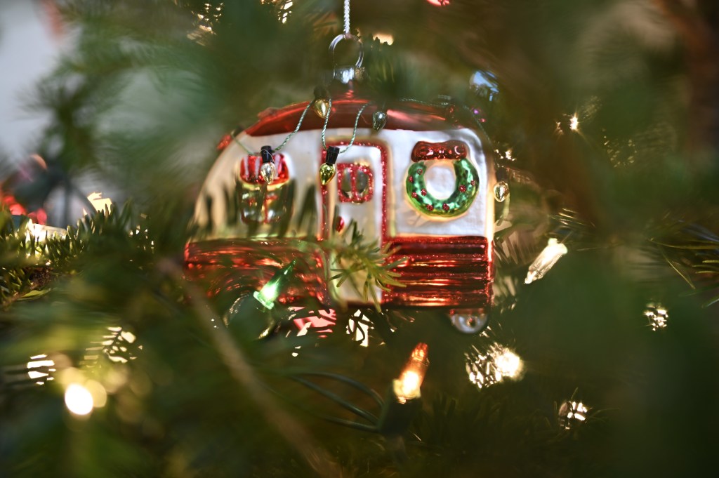 Trailer ornament hanging in a Christmas tree with Christmas lights
